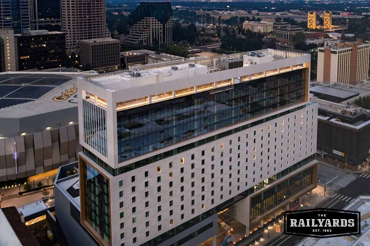 An overhead view of a large building neighboring the Golden 1 Center. Learn about the industries flourishing in Sacramento.