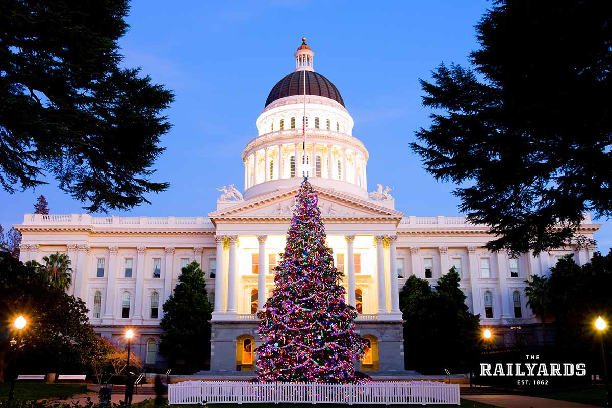 A Christmas tree in front of the California State Capitol lit up for the holidays.