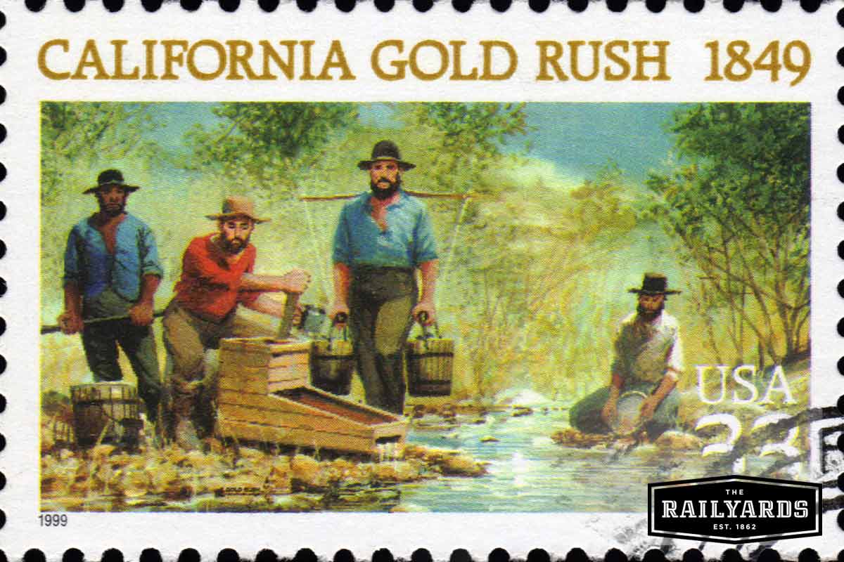 A vintage California Gold Rush postage stamp showing miners panning for gold. Learn more about California history at Railyards.com