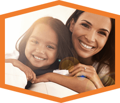 woman and daughter smiling